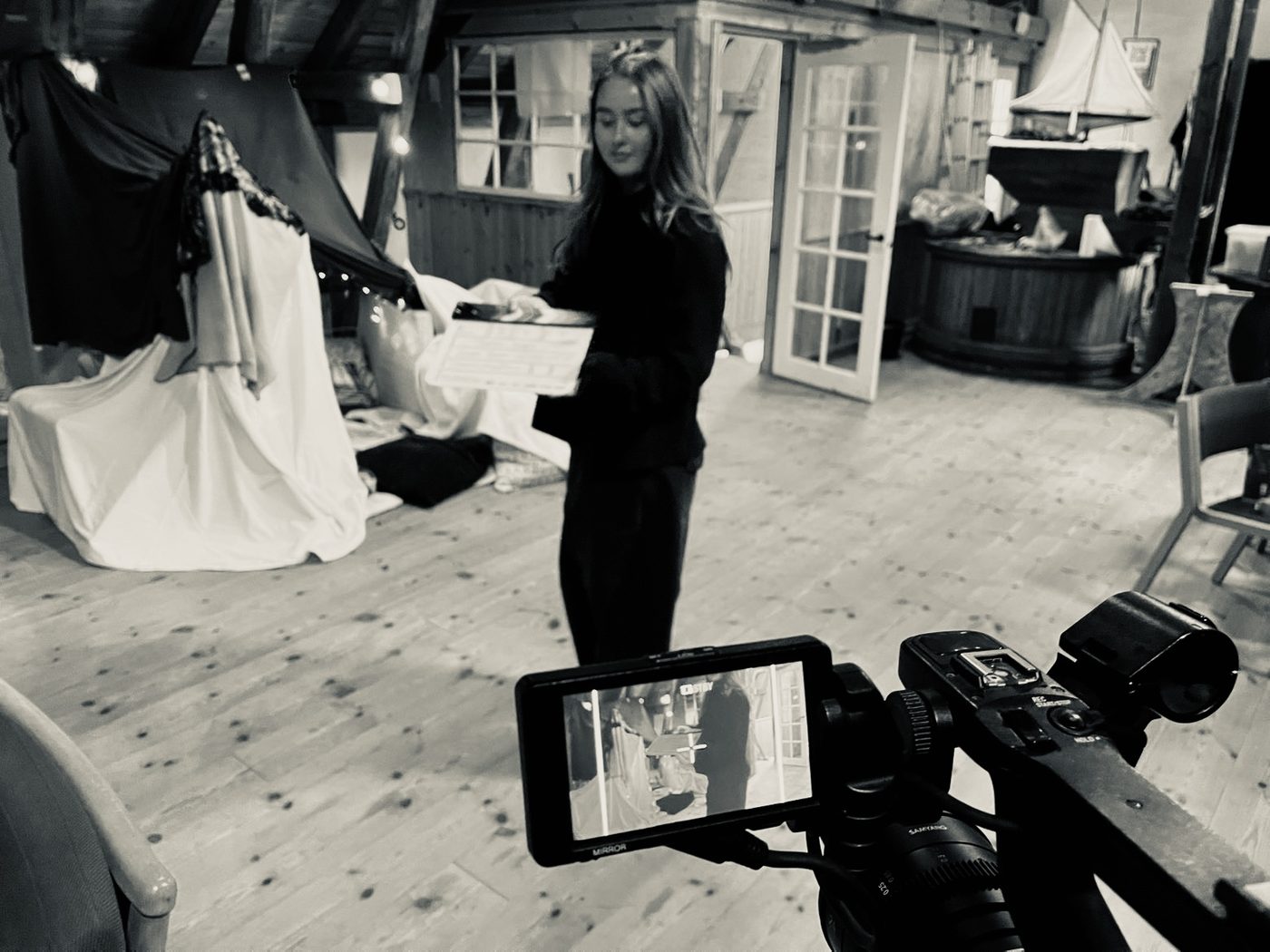 Luna Rosa Kristiansen on set, seen from behind the camera in a dressed room